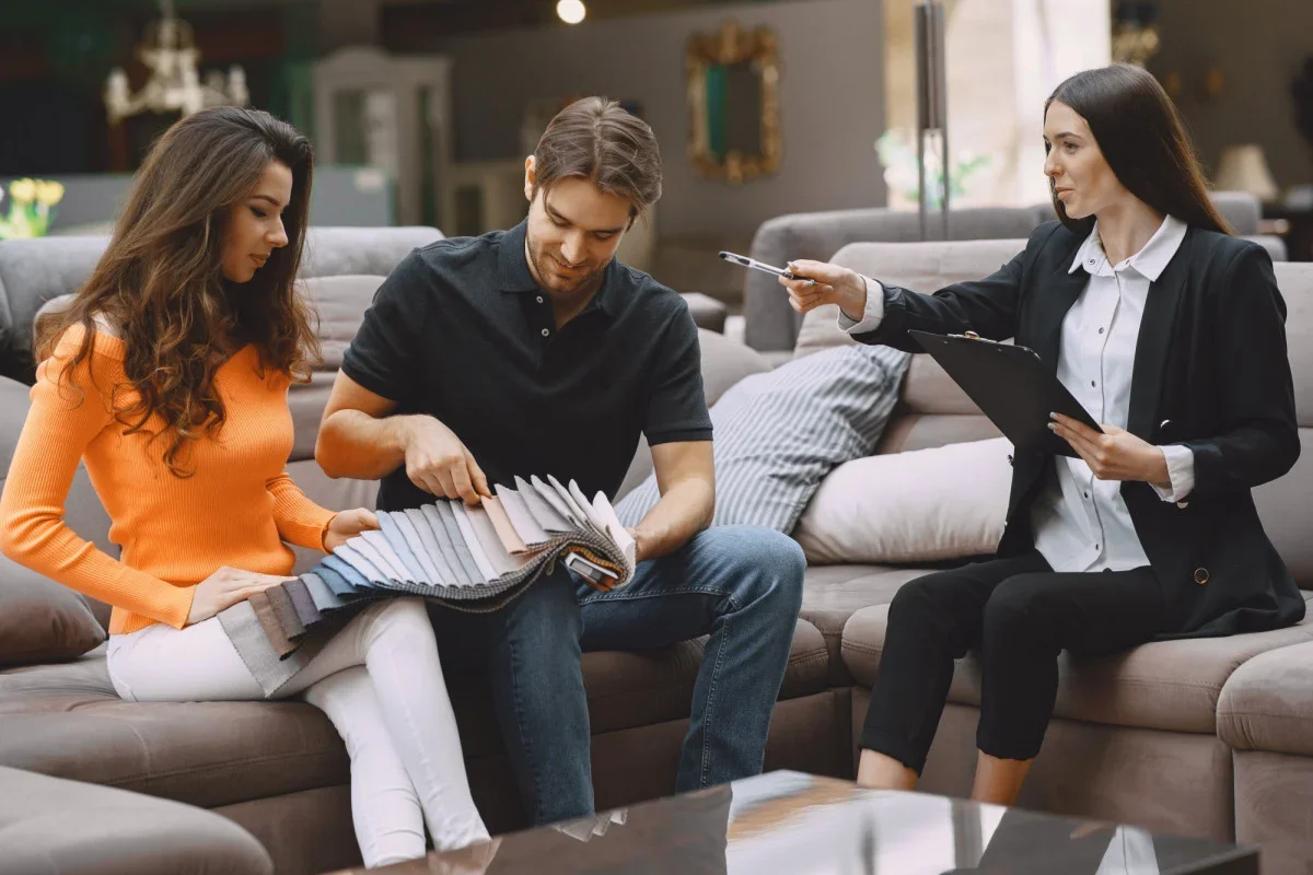 couple choosing fabric furniture store large